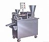 THE AUTOMATIC DUMPLING FORMING MACHINE